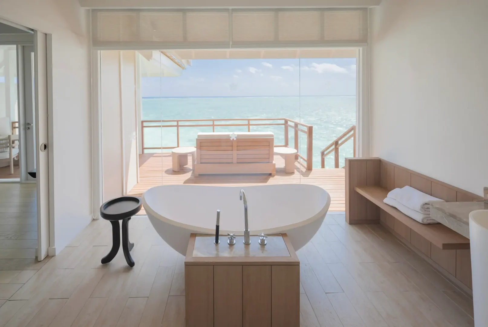 lux south ari atoll over water villa bathroom with elegant island inspired design