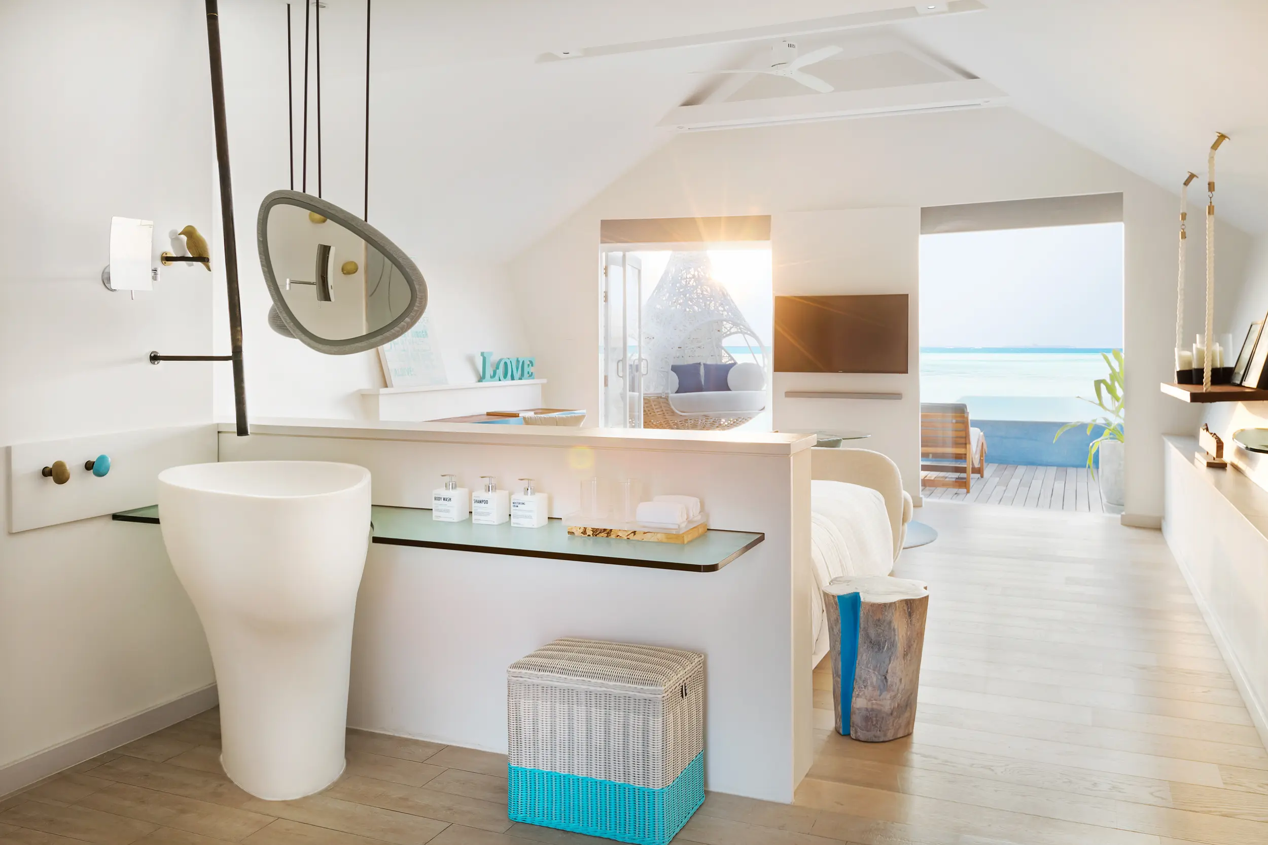 lux south ari atoll overwater infinity pool villa interior view with elegant island inspired design