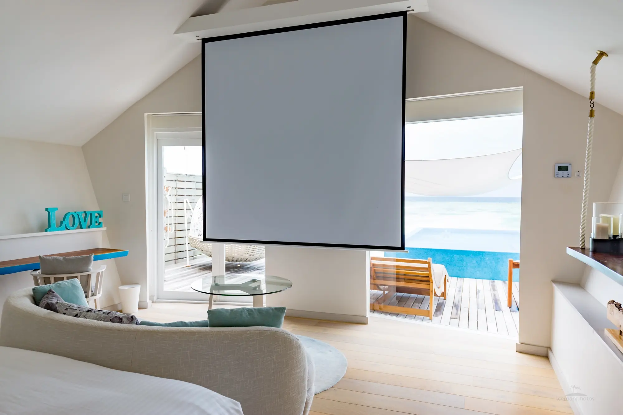 lux south ari atoll overwater infinity pool villa projector creating a relaxed in villa cinema experience