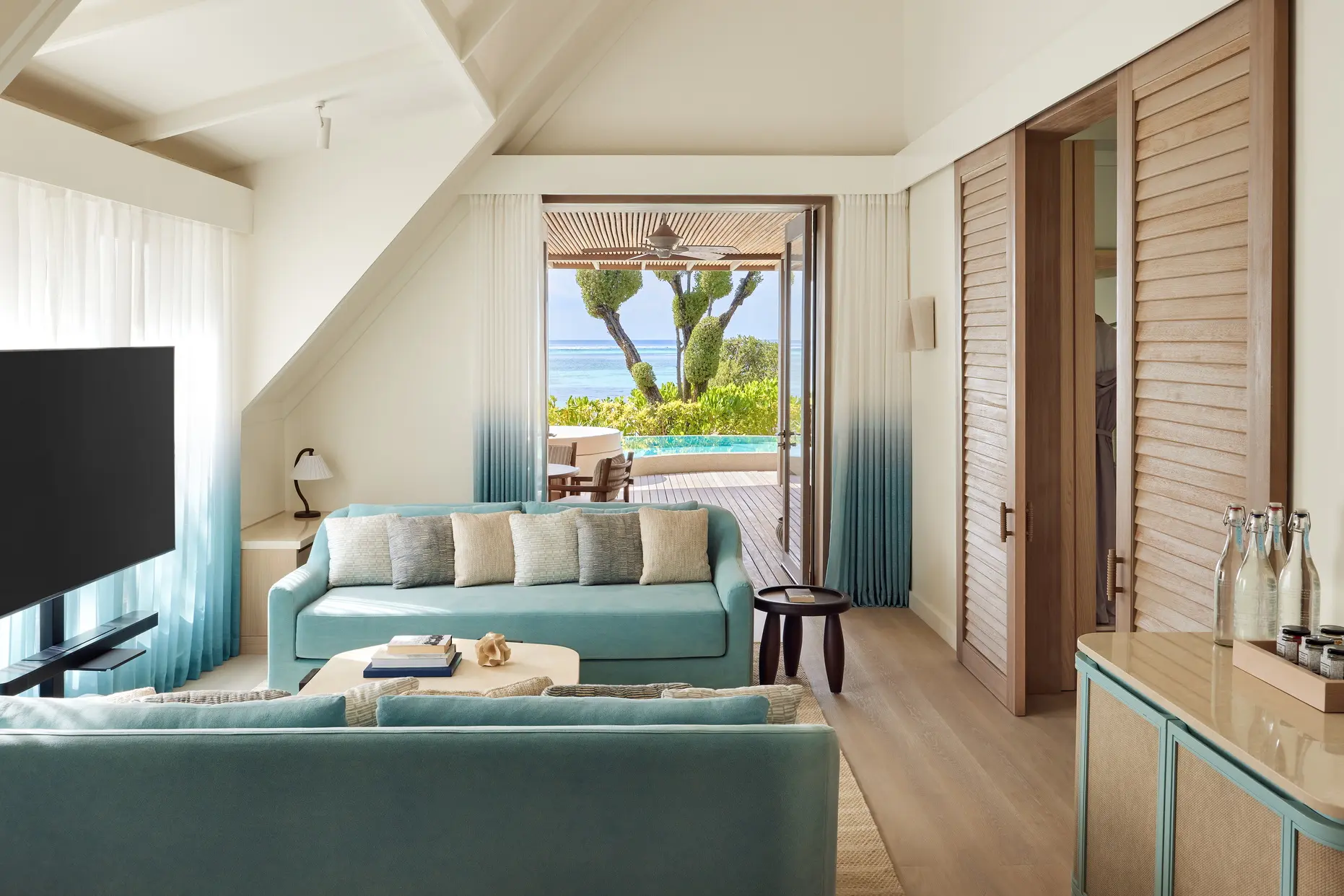 lux south ari atoll temptation beach pool villa living area with elegant island inspired interior design