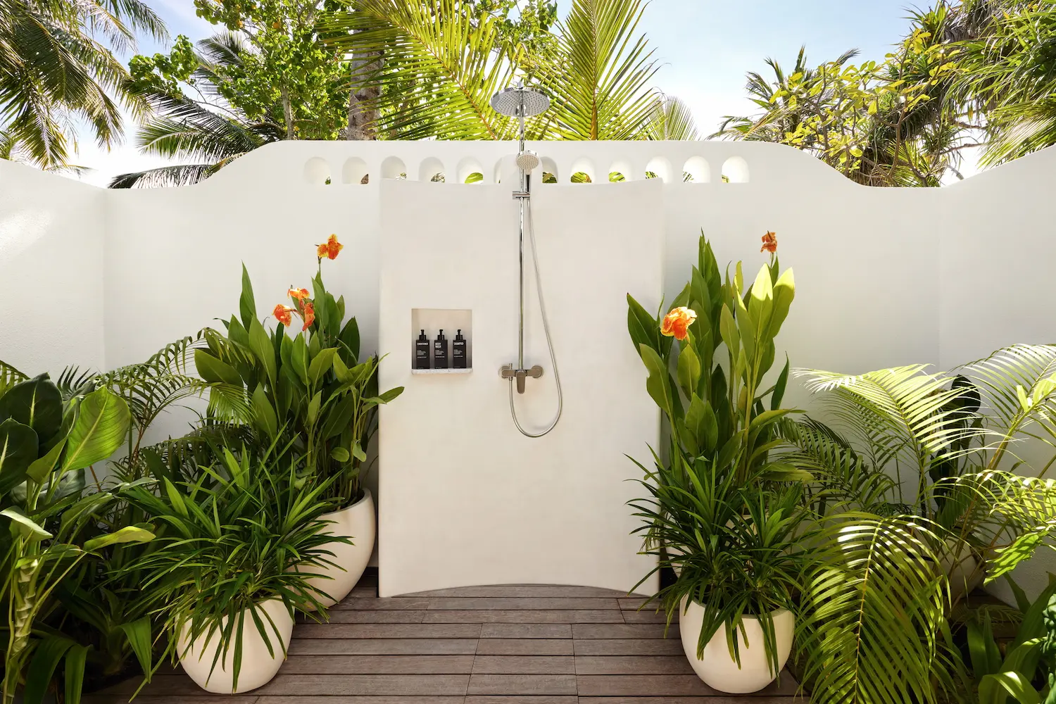 lux south ari atoll temptation beach pool villa outdoor shower surrounded by tropical greenery