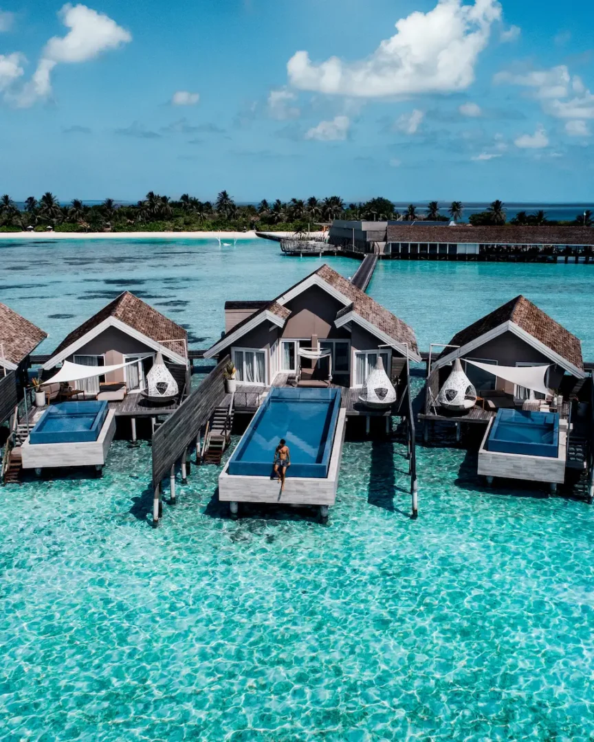 lux south ari atoll temptation pool water villas aerial view over the turquoise lagoon