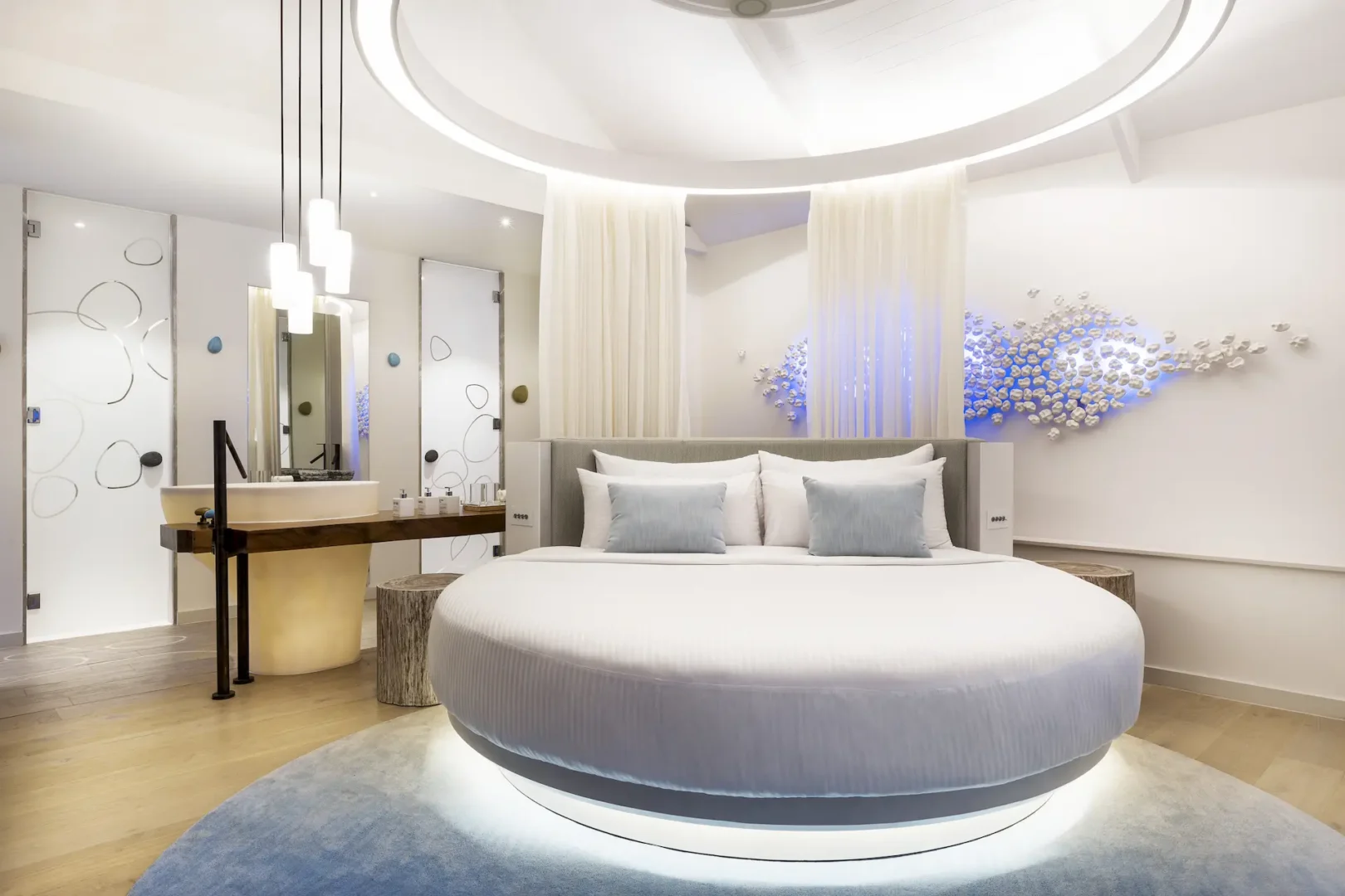 lux south ari atoll temptation pool water villas bedroom with serene island inspired design