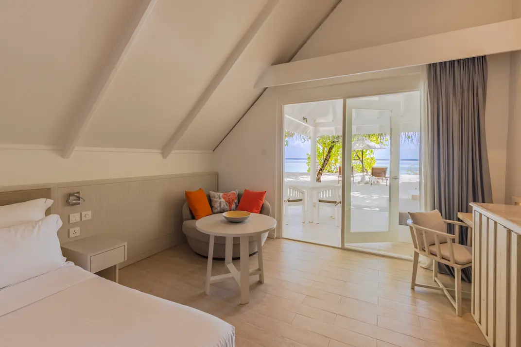 lux south ari atoll two bed family beach pavilion interior with bright spacious island inspired design