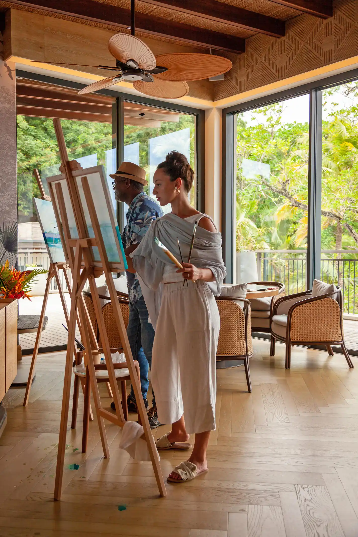 mango house seychelles guest enjoying an experience painting session