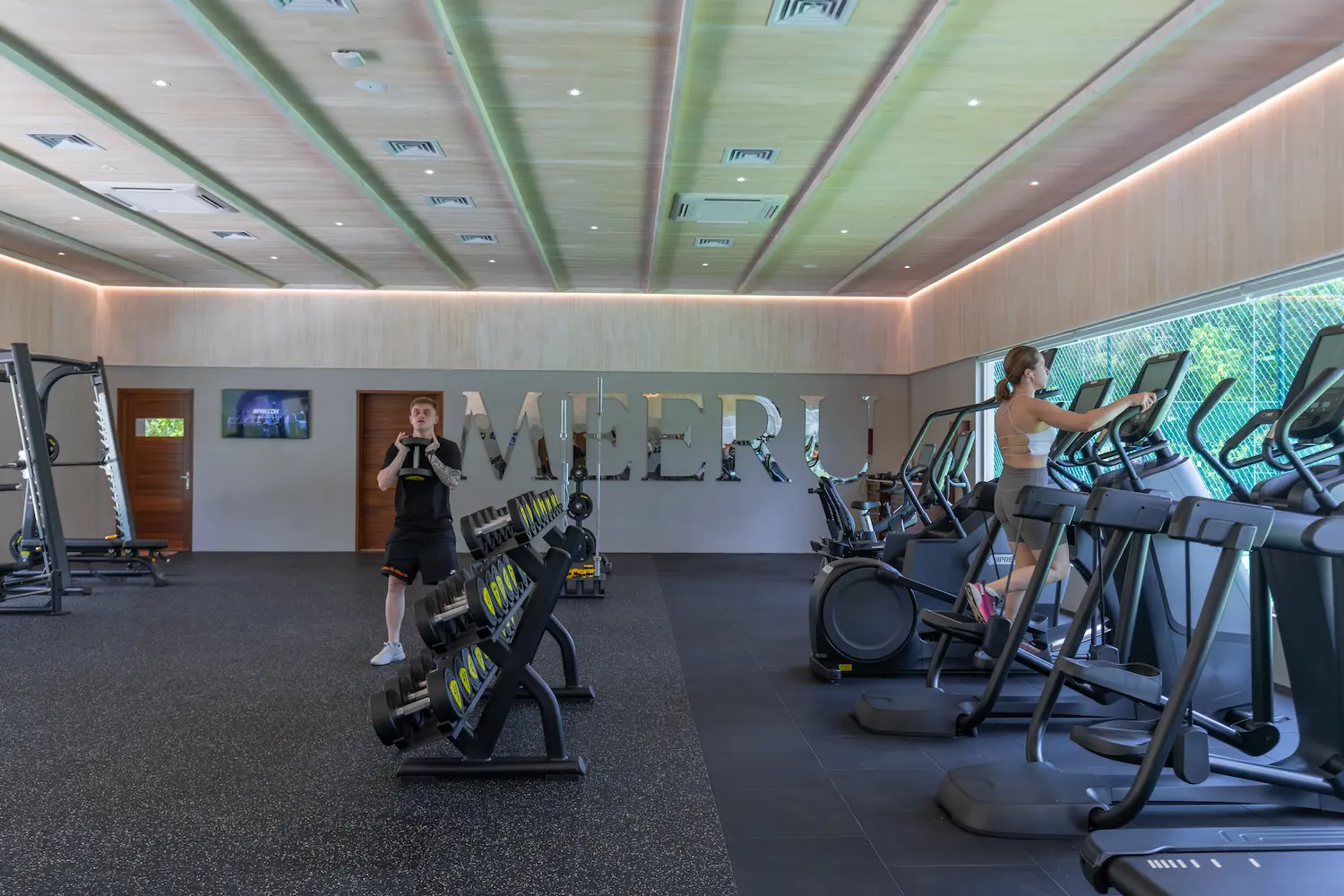 meeru maldives fitness centre with bright natural light modern equipment and a clean spacious layout designed for a relaxed luxury wellness experience