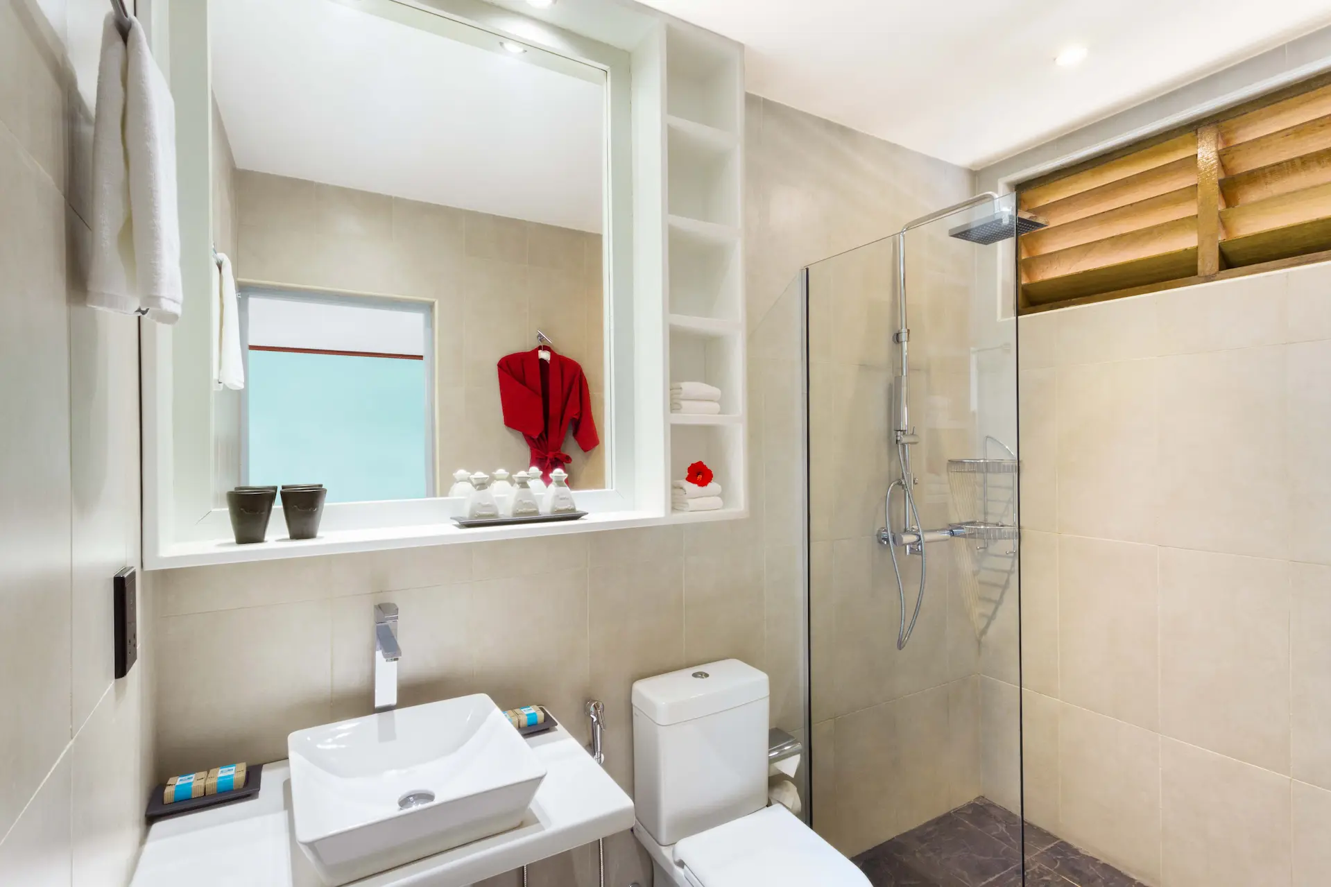 meeru maldives garden room bathroom with a calm spa like atmosphere soft natural tones and gentle ambient light creating a clean modern and relaxing resort experience