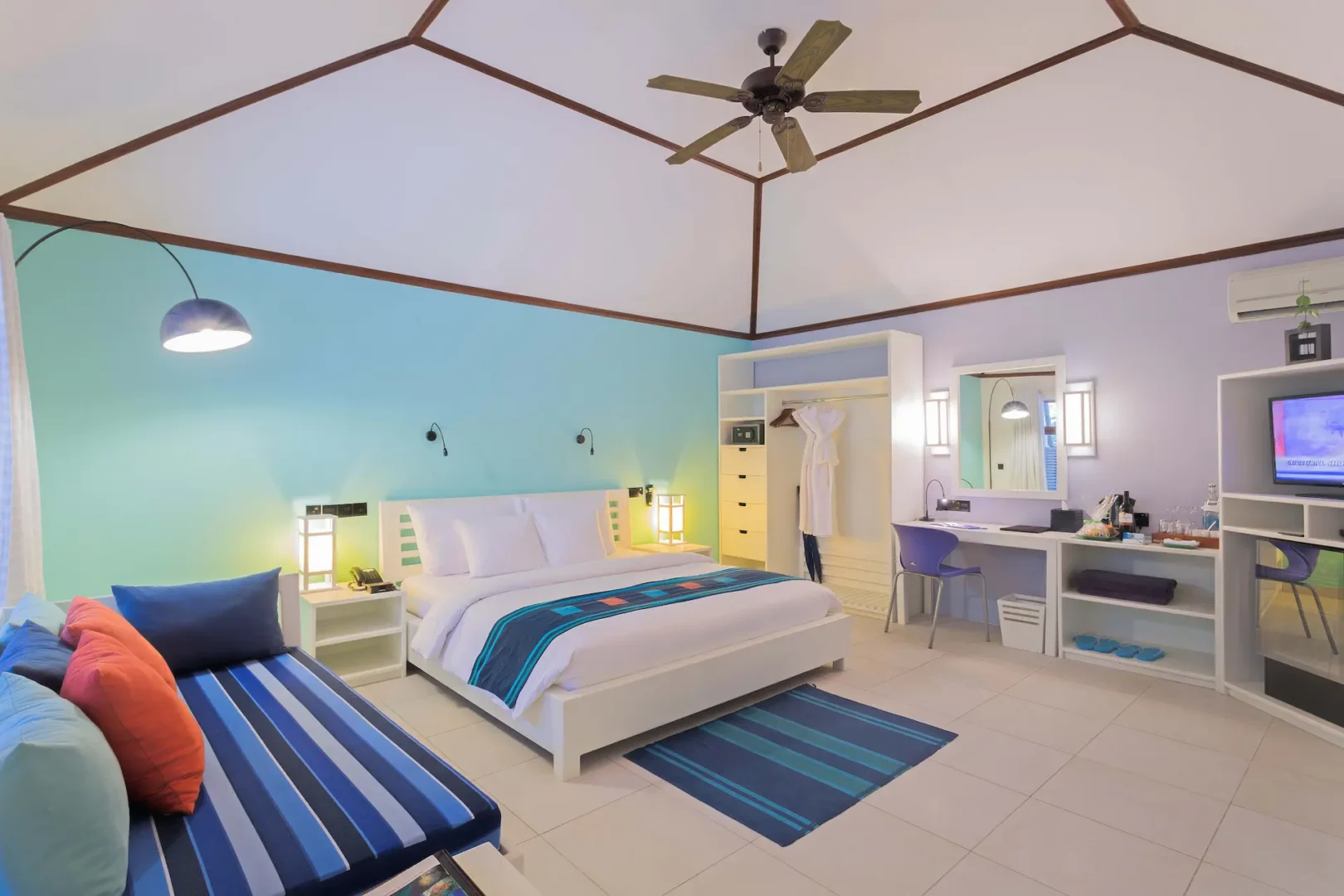 meeru maldives garden room interior featuring soft natural lighting warm wood accents and a calm contemporary layout that enhances the serene luxury resort atmosphere