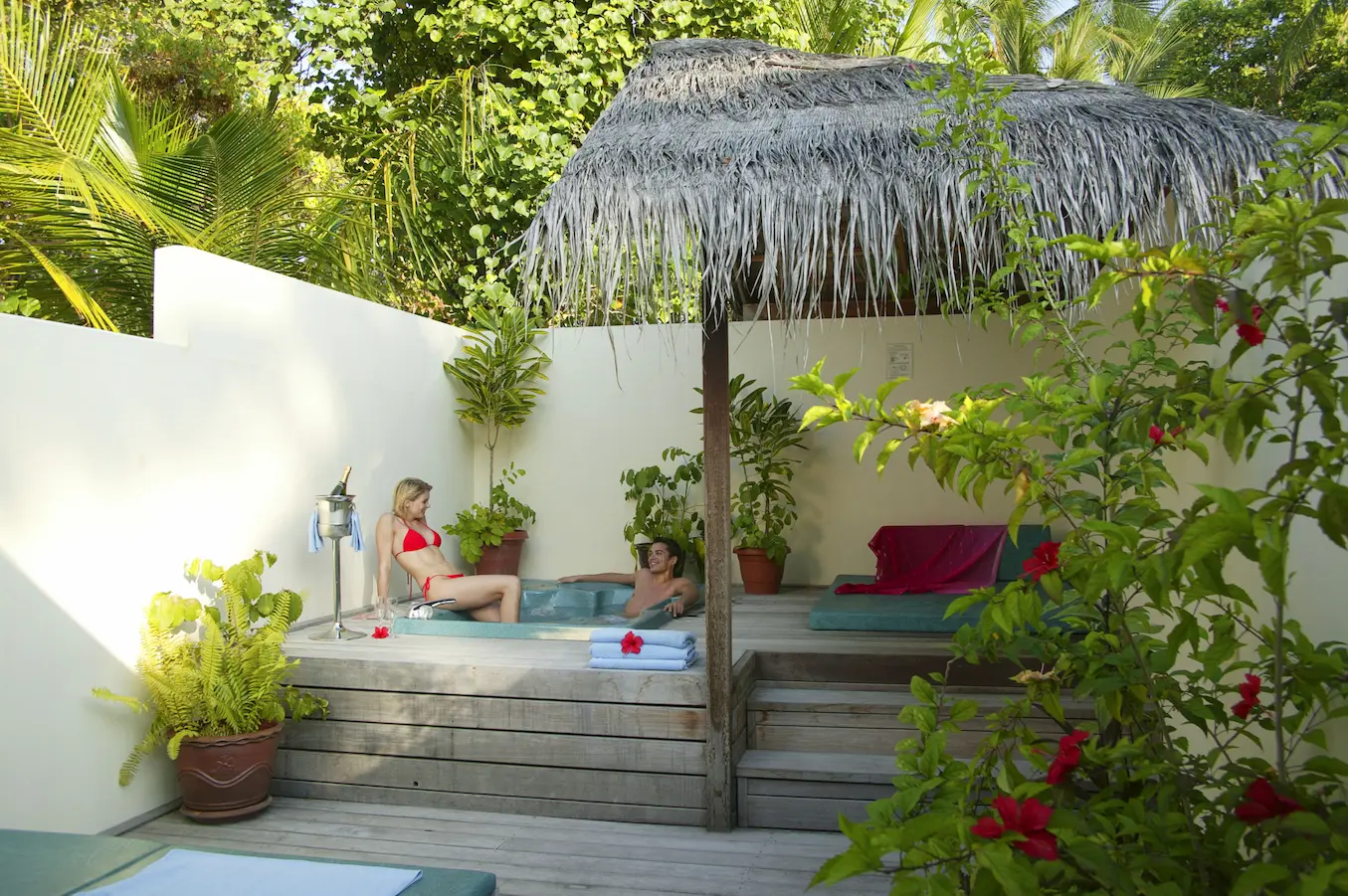 meeru maldives jacuzzi beach villa jacuzzi area lifestyle scene with soft natural light tropical greenery and a calm private setting that reflects the resort’s relaxed luxury atmosphere