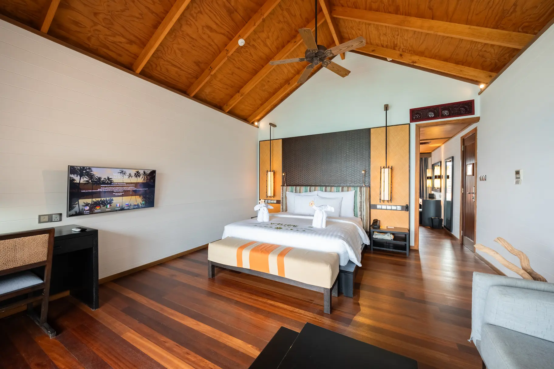 meeru maldives jacuzzi water villa interior bedroom with soft natural lighting warm wood accents and a serene contemporary layout that enhances the resort’s relaxed luxury atmosphere