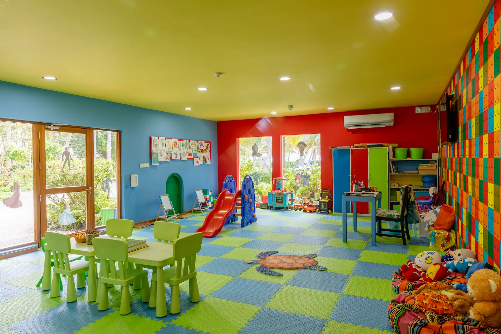 meeru maldives koamas kids play room with bright natural light colorful activity areas and a fun welcoming space designed for a relaxed family friendly resort experience