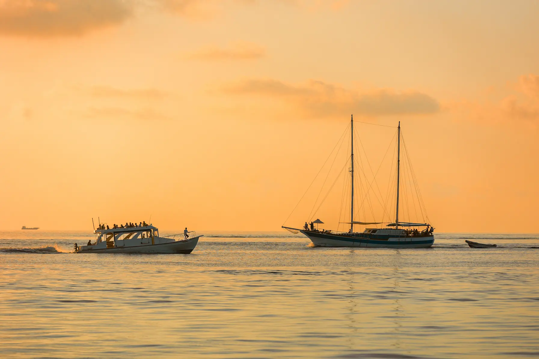 meeru maldives sunset yacht trip and sunset cruise with golden evening light calm ocean views and a serene luxury experience on the water