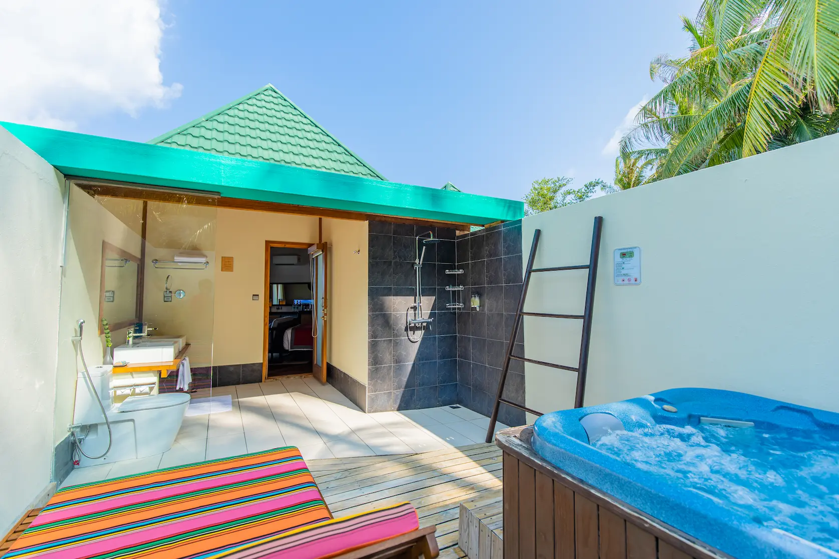 meeru maldives waterfront villa jacuzzi area with serene lagoon views soft natural light and a calm elegant setting that enhances the resort’s relaxed luxury atmosphere