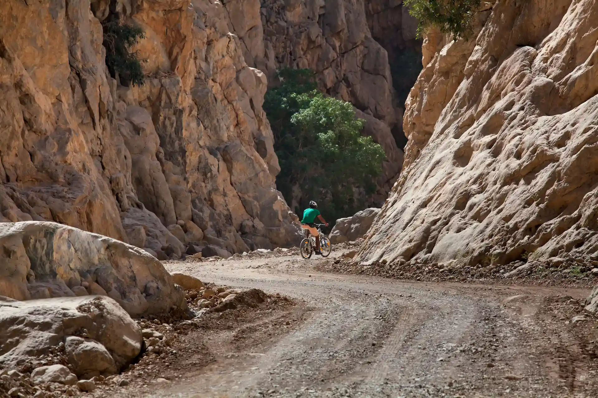 guests mountain biking at six senses zighy bay oman resort
