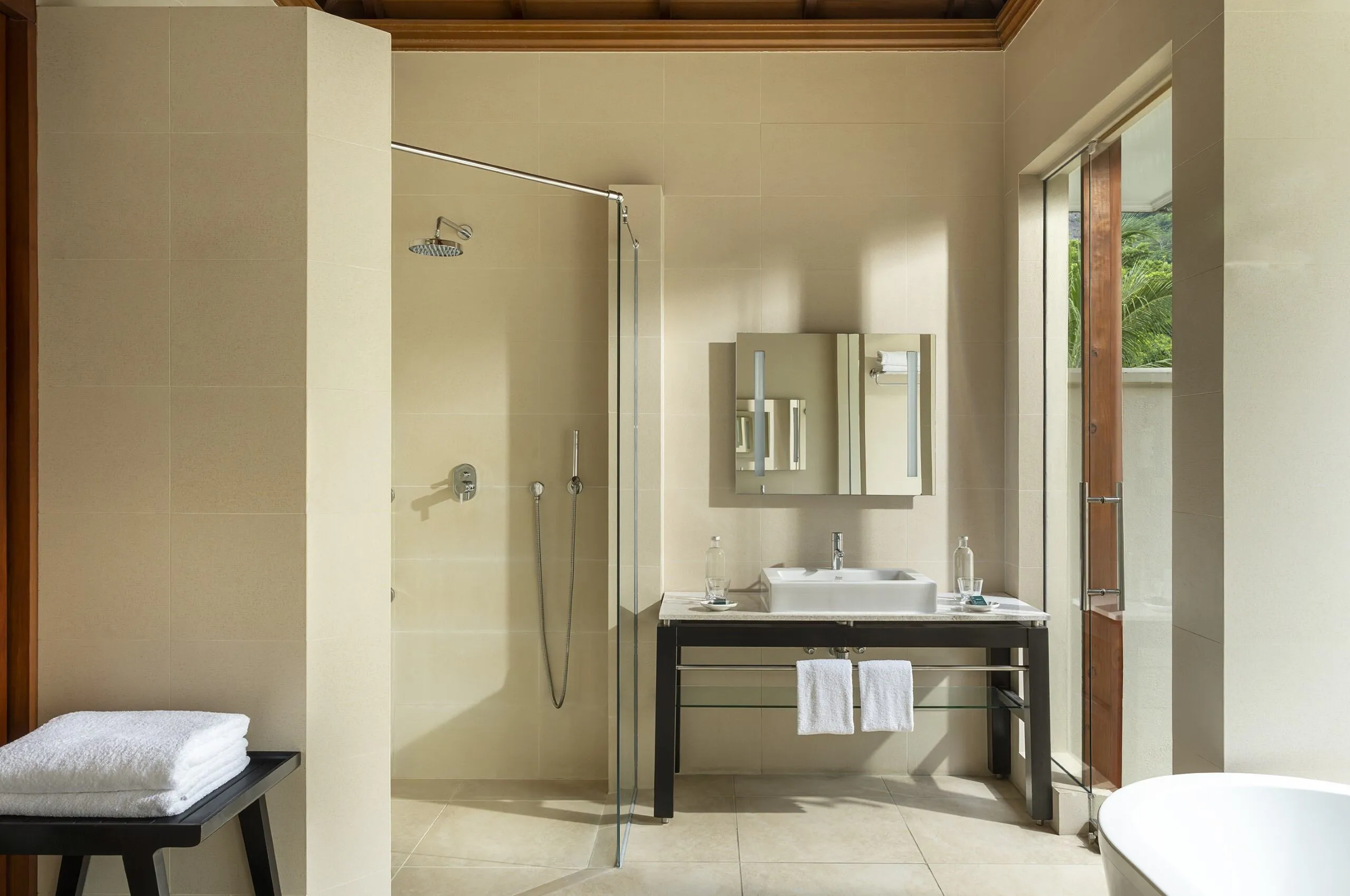 niva labriz seychelles beach villa bathroom with modern fixtures and ocean view