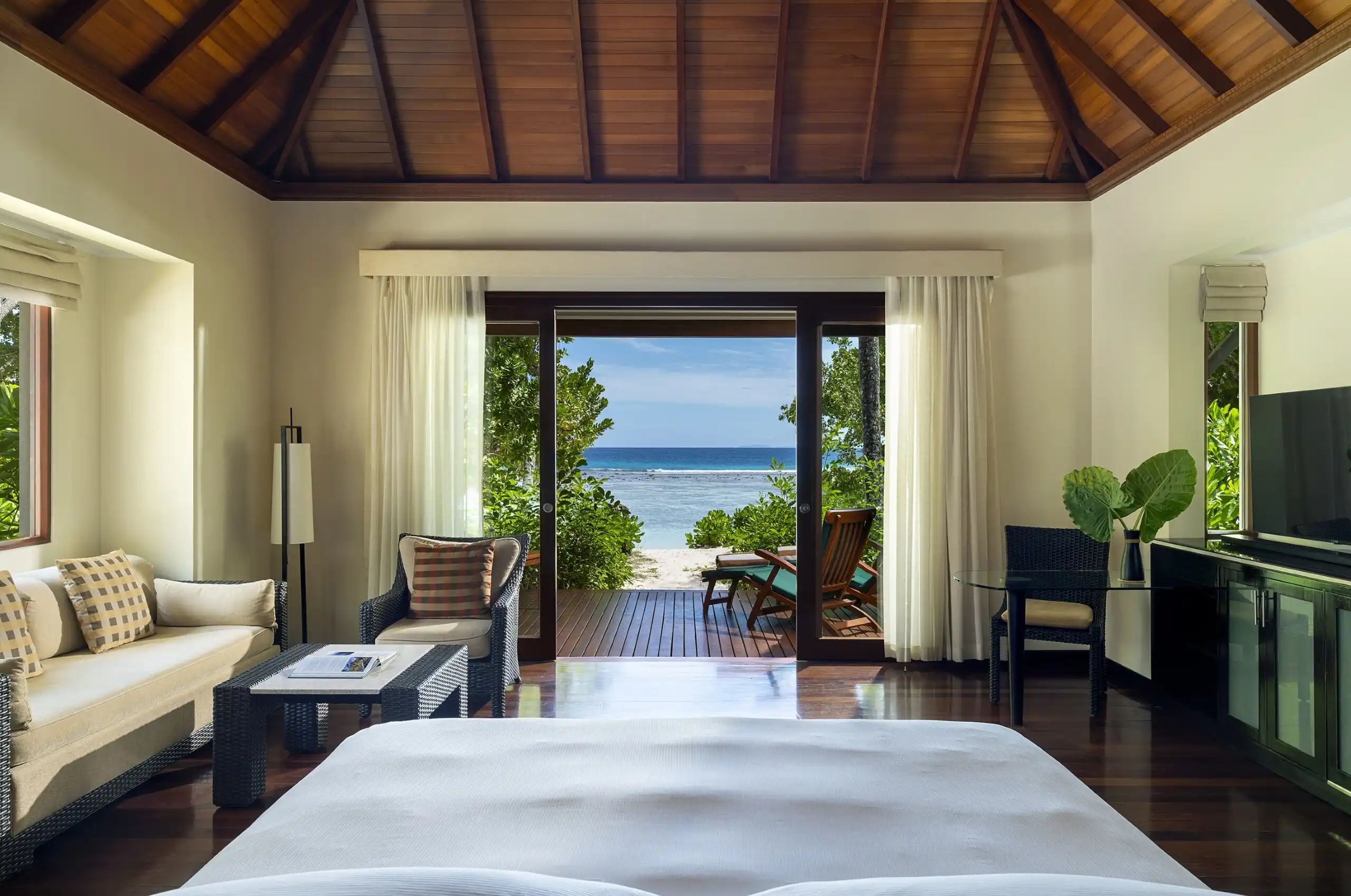 niva labriz seychelles beach villa with garden plunge pool bedroom view of king bed and tropical surroundings