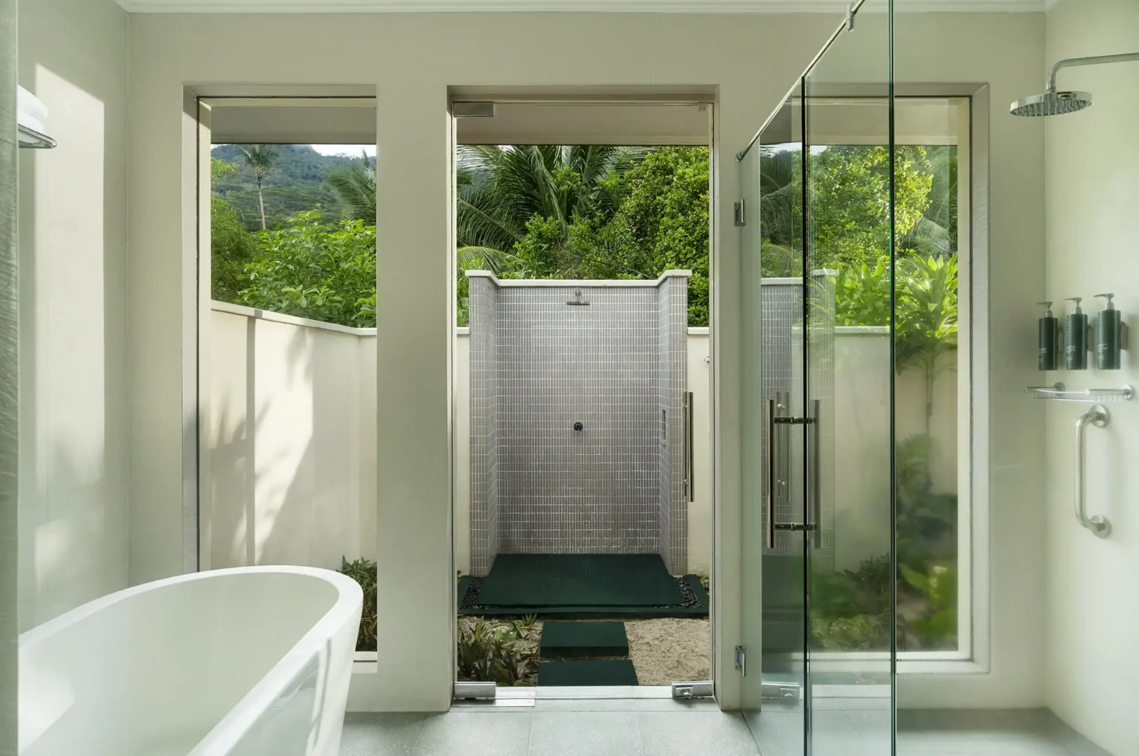 niva labriz seychelles beach villa with garden plunge pools bathroom with shower and tropical surroundings