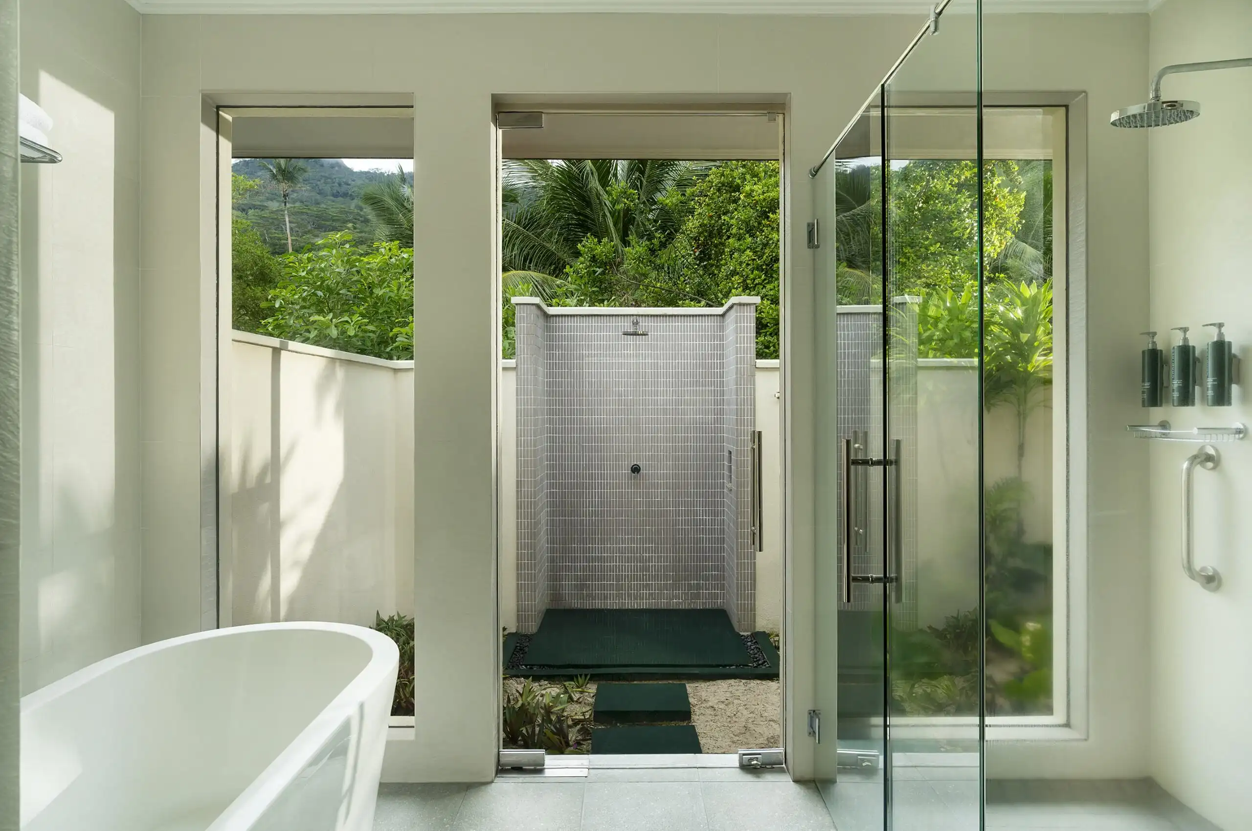 niva labriz seychelles beach villa with garden plunge pools bathroom with shower and tropical surroundings