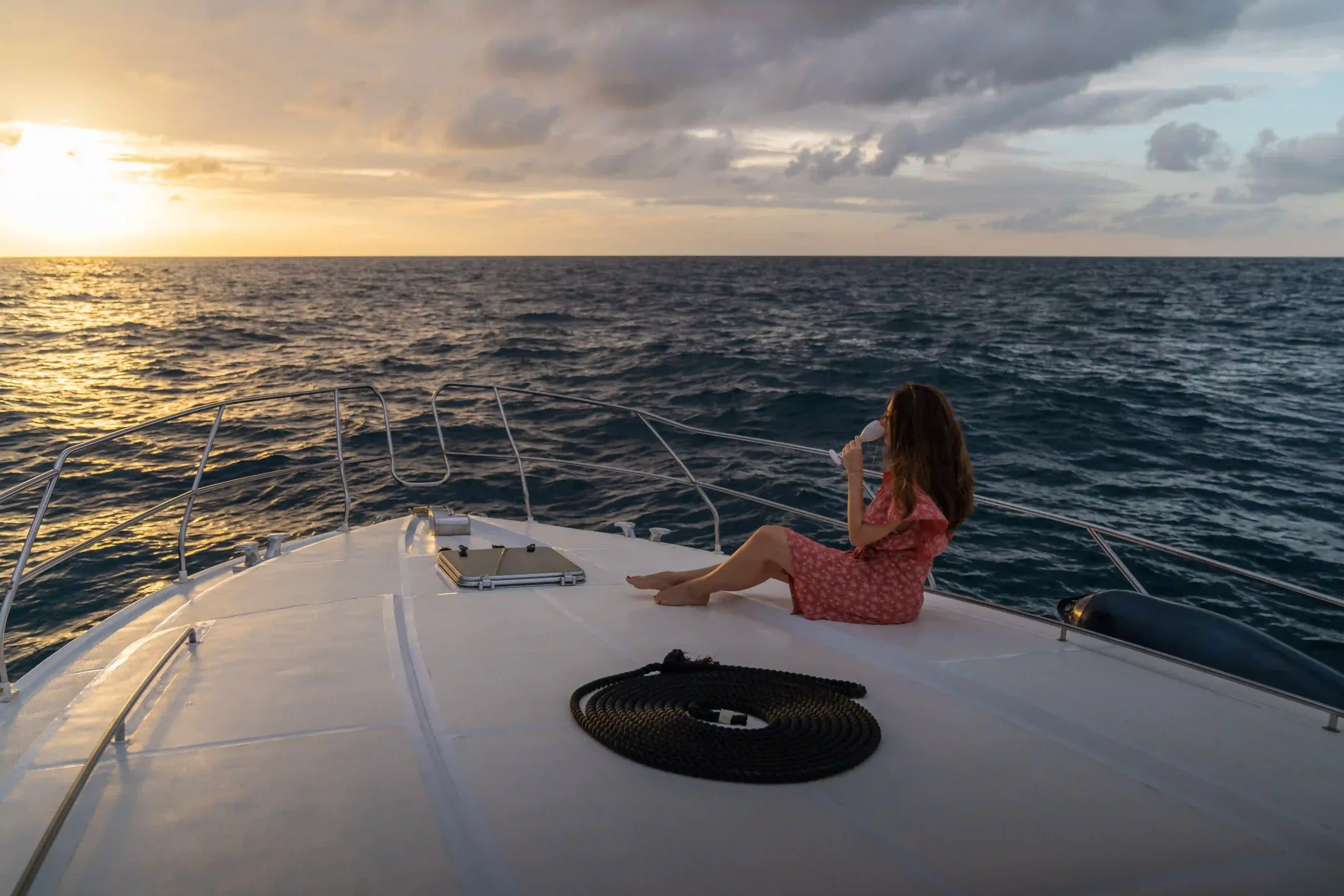 niva labriz seychelles boat at sunset over turquoise waters with tropical horizon