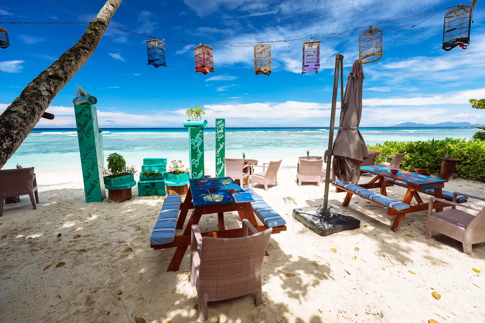 niva labriz seychelles four degrees bar with outdoor seating and tropical view