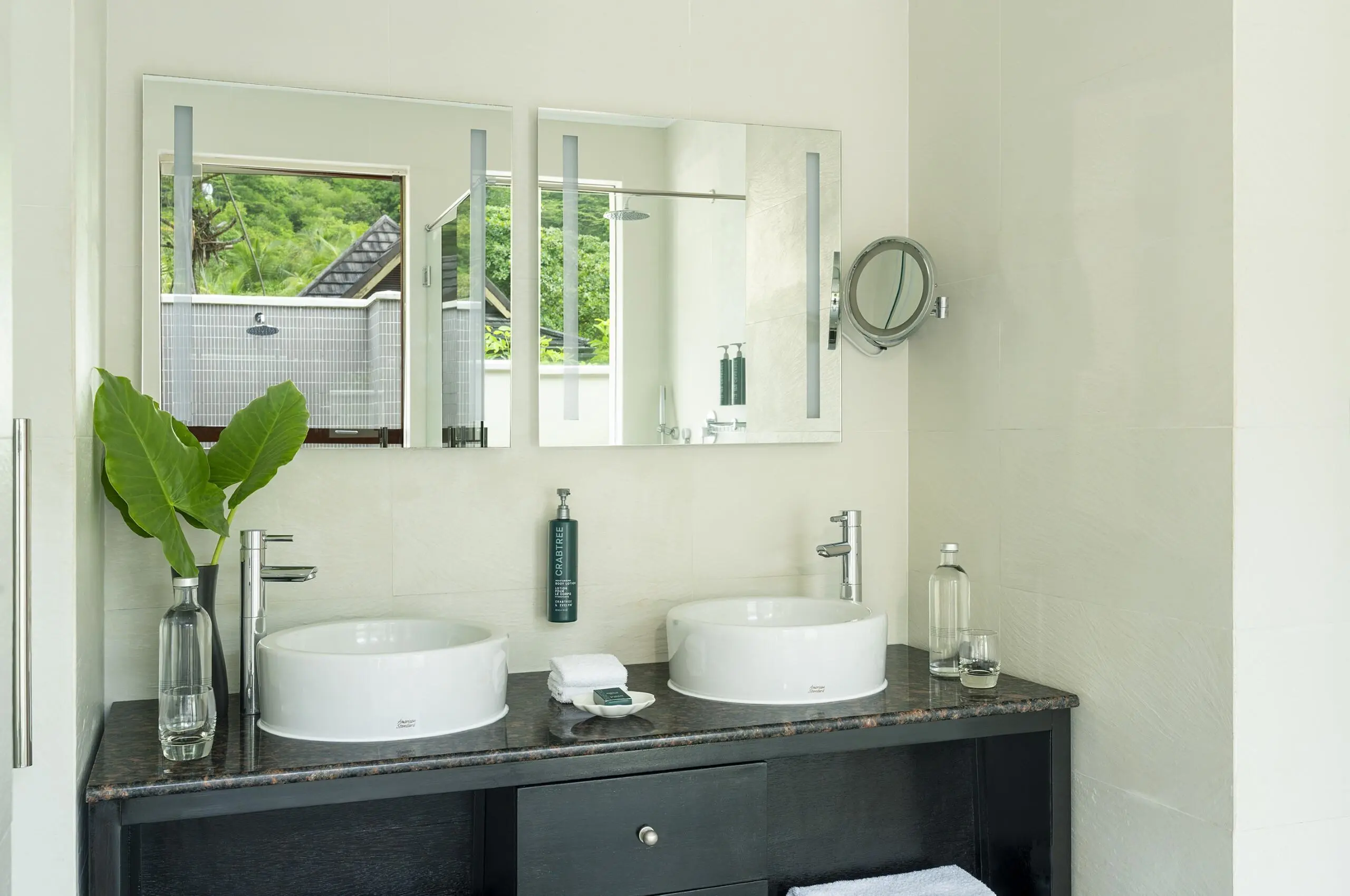 niva labriz seychelles garden oasis pool villa bathroom sinks with elegant design and tropical surroundings