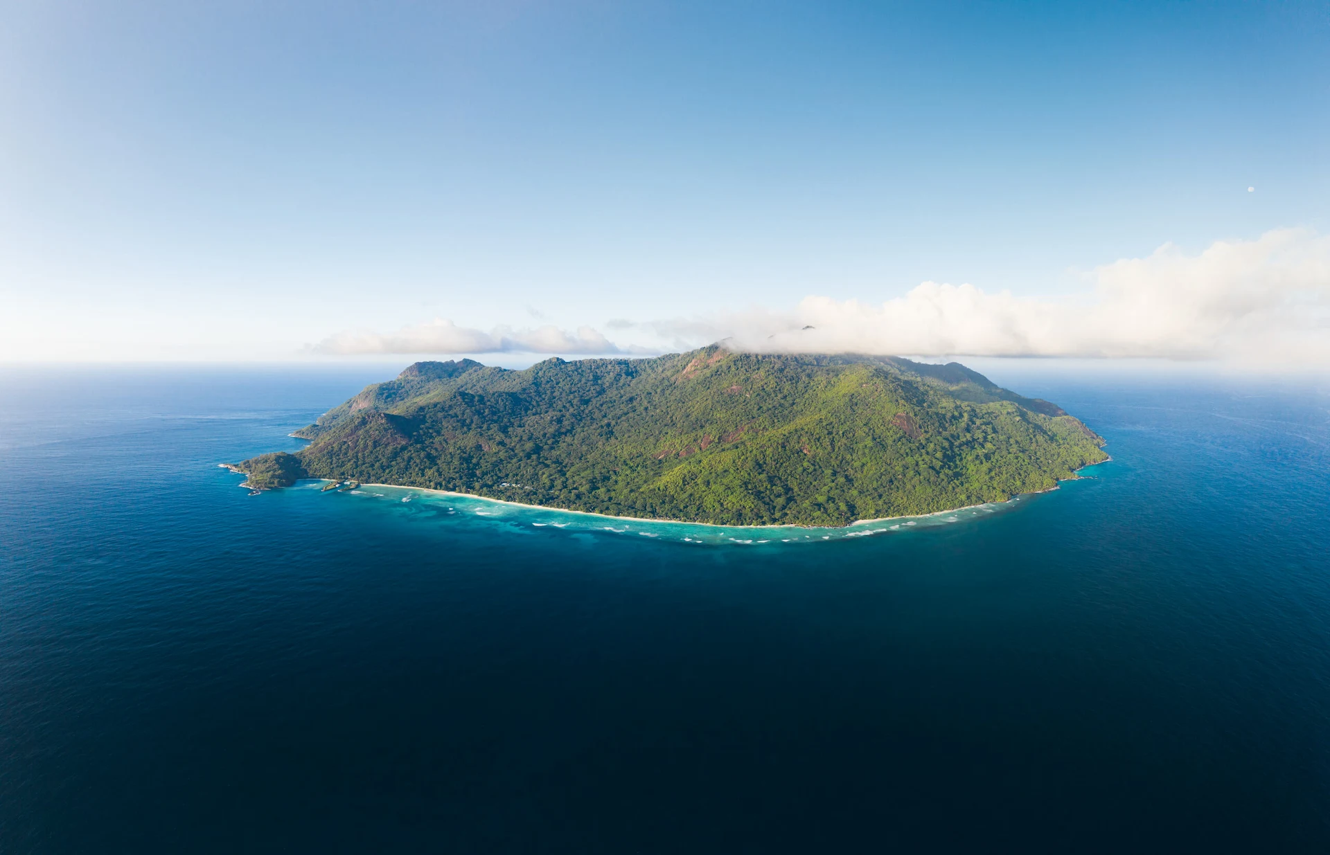 niva labriz seychelles island surrounded by turquoise waters and tropical vegetation