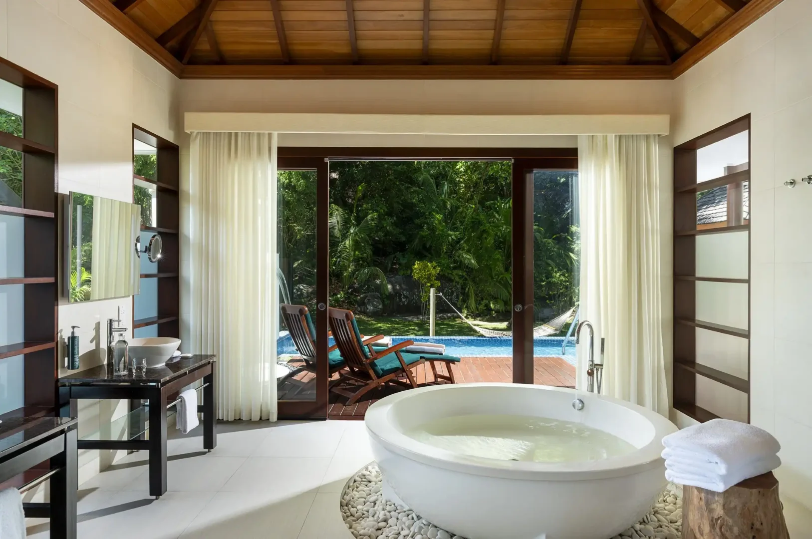 niva labriz seychelles jungle sanctuary pool villa bath with freestanding tub and jungle view