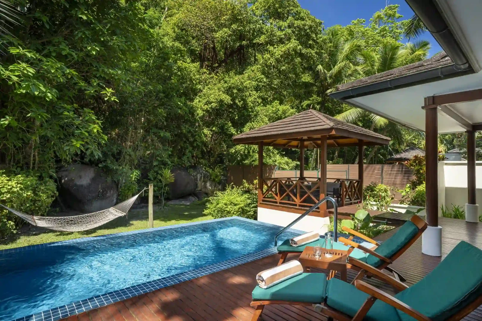 niva labriz seychelles jungle sanctuary pool villa pool surrounded by dense jungle and tropical greenery