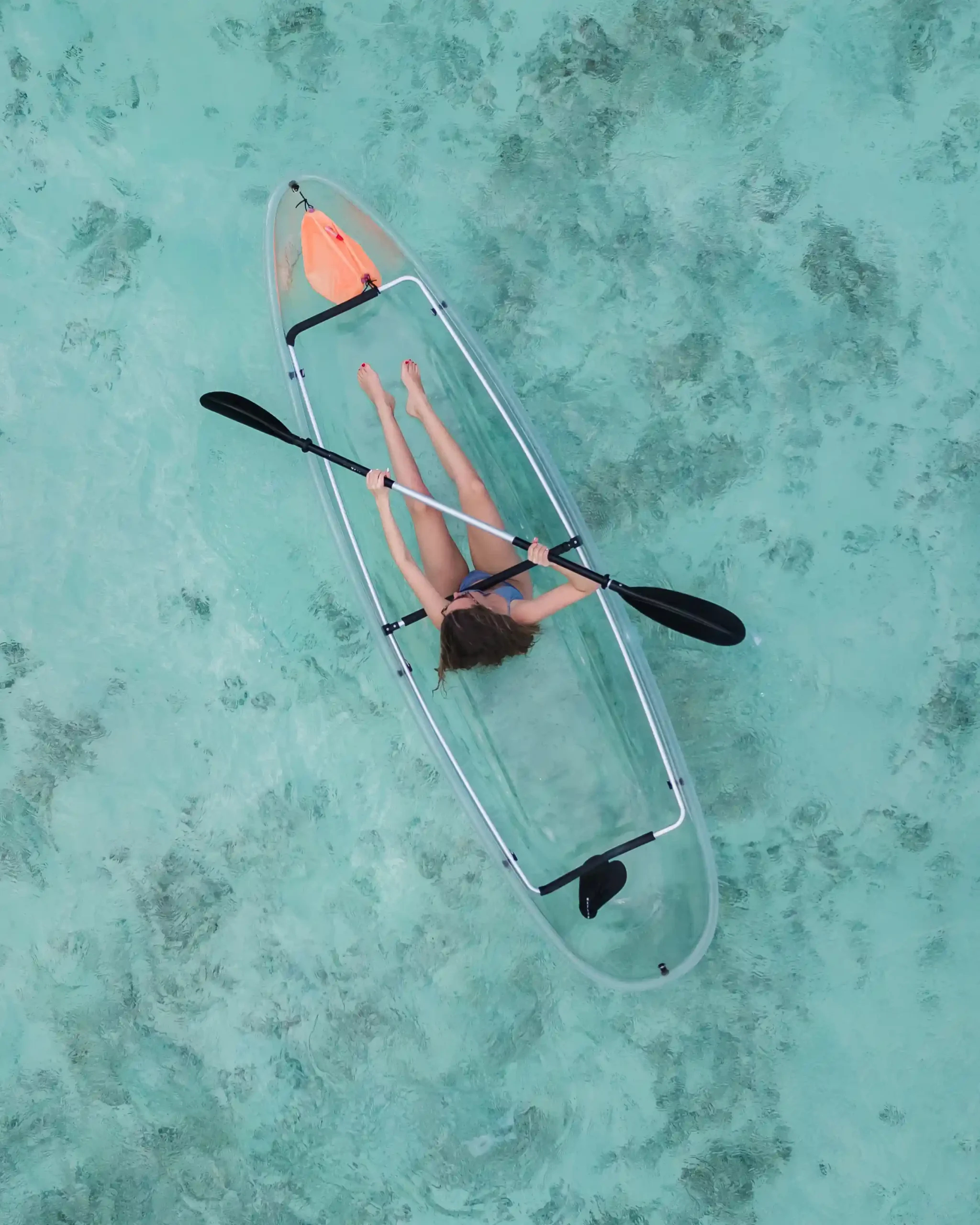 niva labriz seychelles kayaking in crystal clear waters with tropical scenery