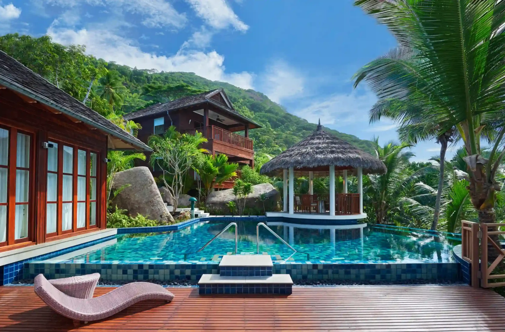 niva labriz seychelles two bedroom labriz retreat pool area with sun loungers and tropical surroundings