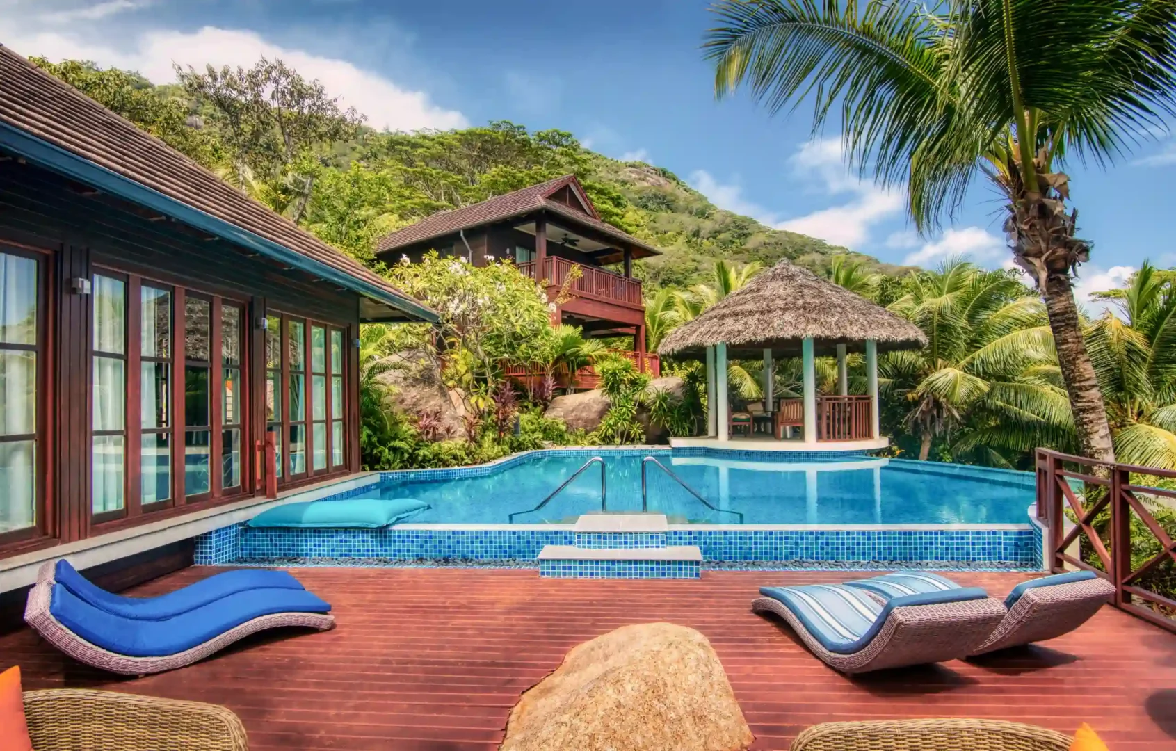niva labriz seychelles two bedroom labriz retreat pool area with sun loungers and tropical surroundings