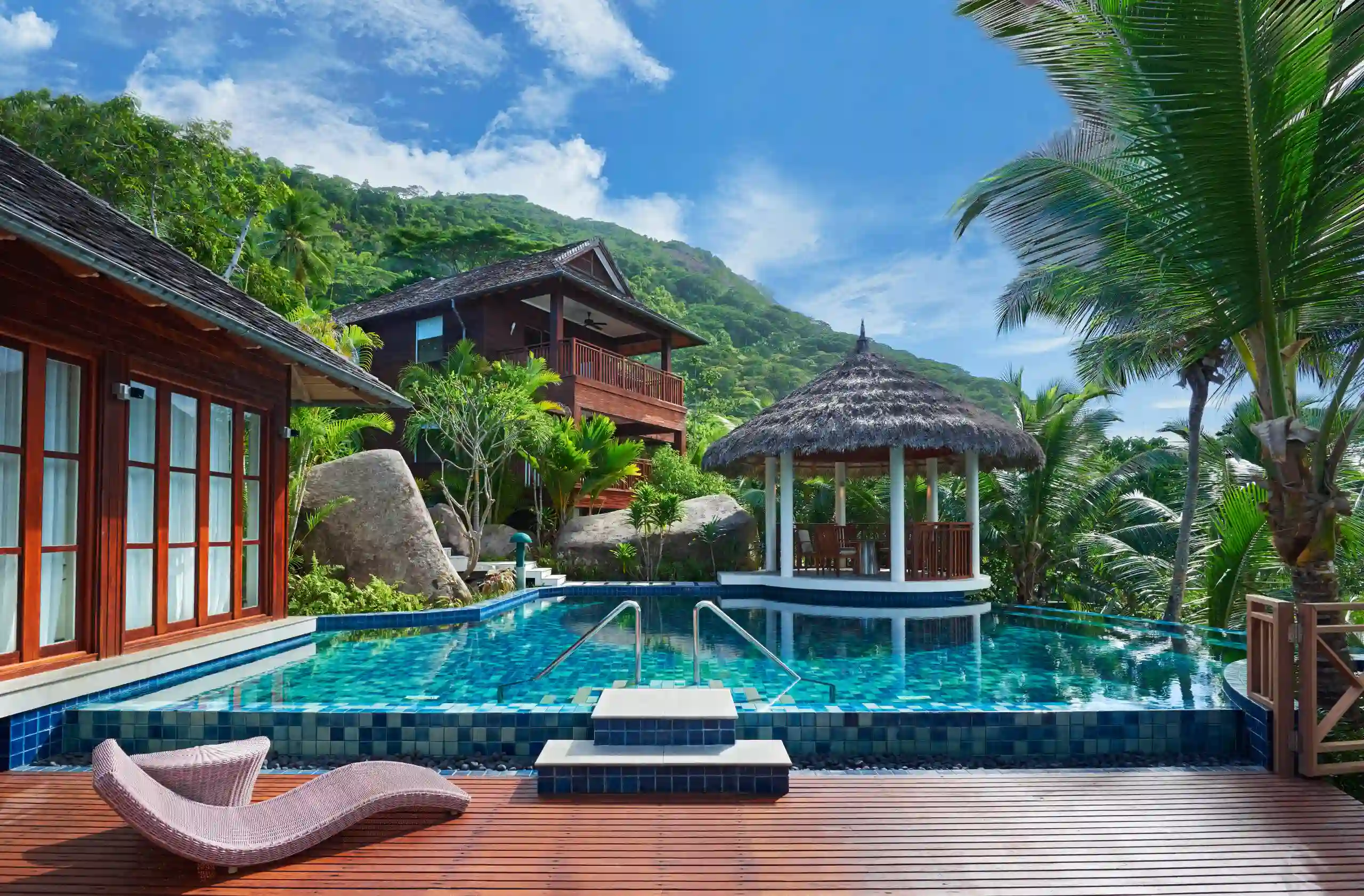 niva labriz seychelles two bedroom labriz retreat pool area with sun loungers and tropical surroundings