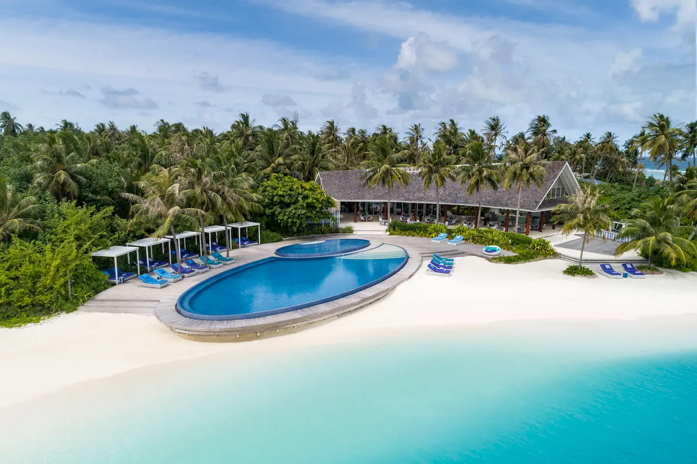 niyama private islands maldives blu aerial shot showcasing the beachfront restaurant setting and serene island surroundings