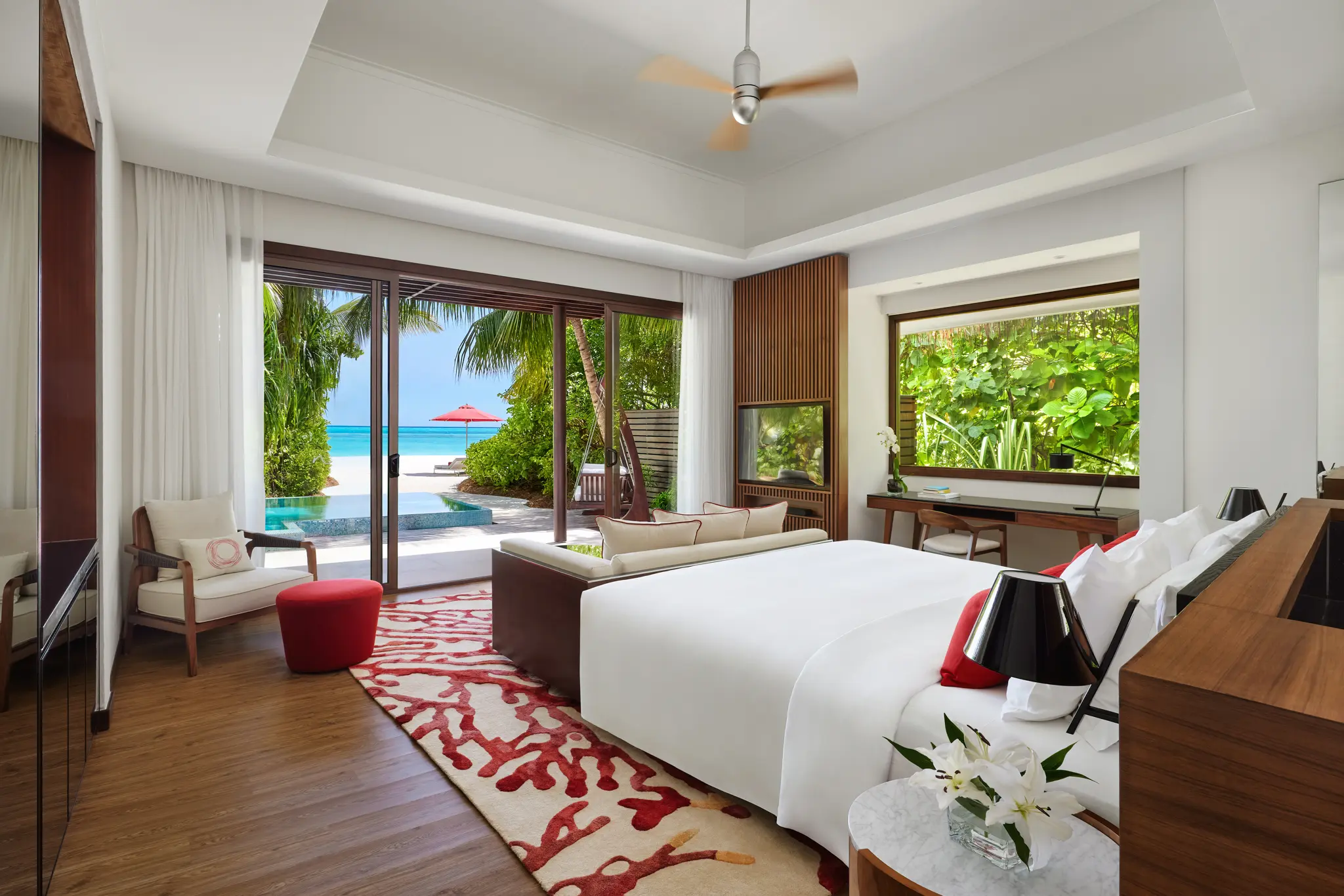 niyama private islands maldives deluxe beach pool villa bedroom featuring tranquil island style decor and refined contemporary comfort