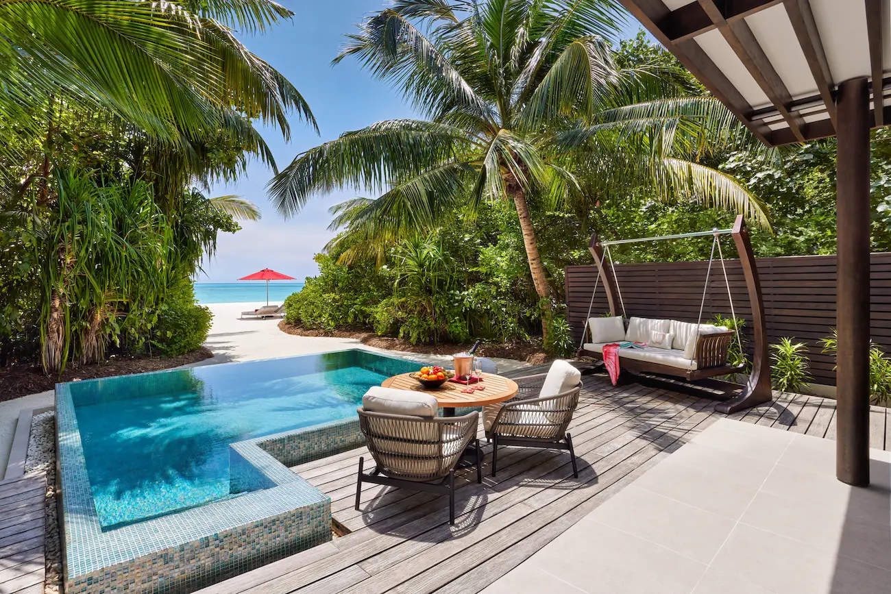 niyama private islands maldives deluxe beach pool villa deck offering tranquil oceanside lounging and refined island luxury