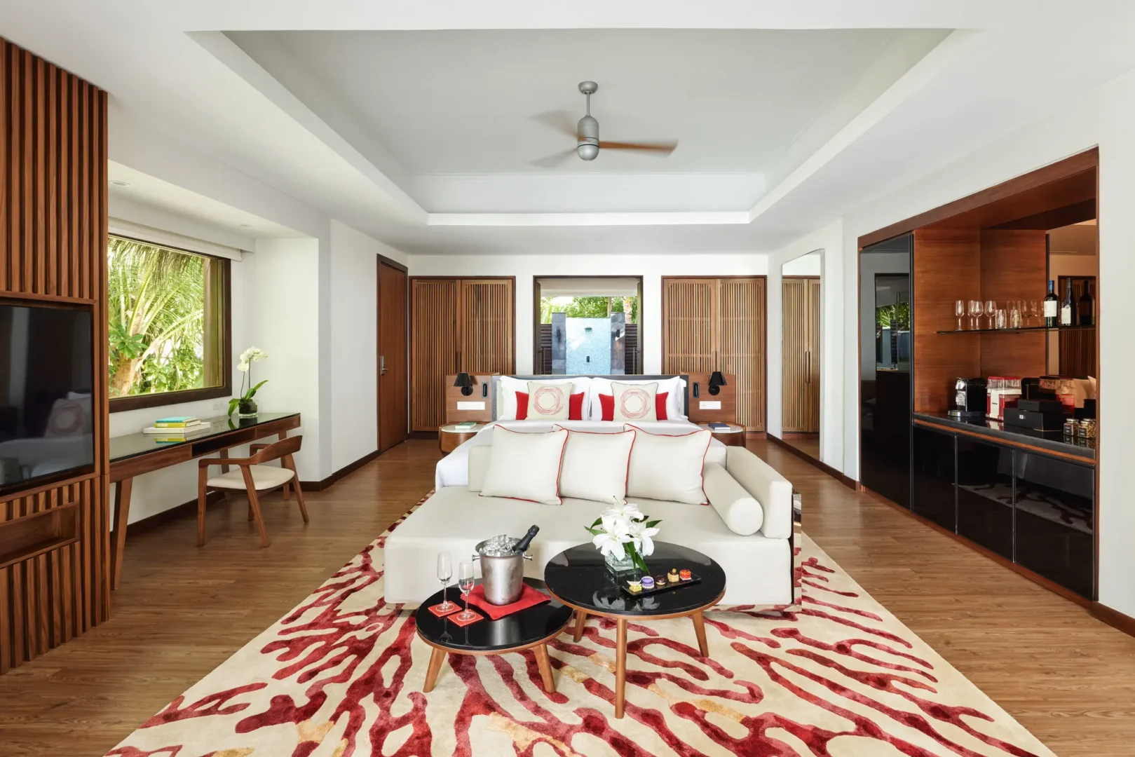 niyama private islands maldives deluxe beach villa interior showcasing a refined luxury space with natural island textures warm lighting and a calm contemporary coastal ambiance