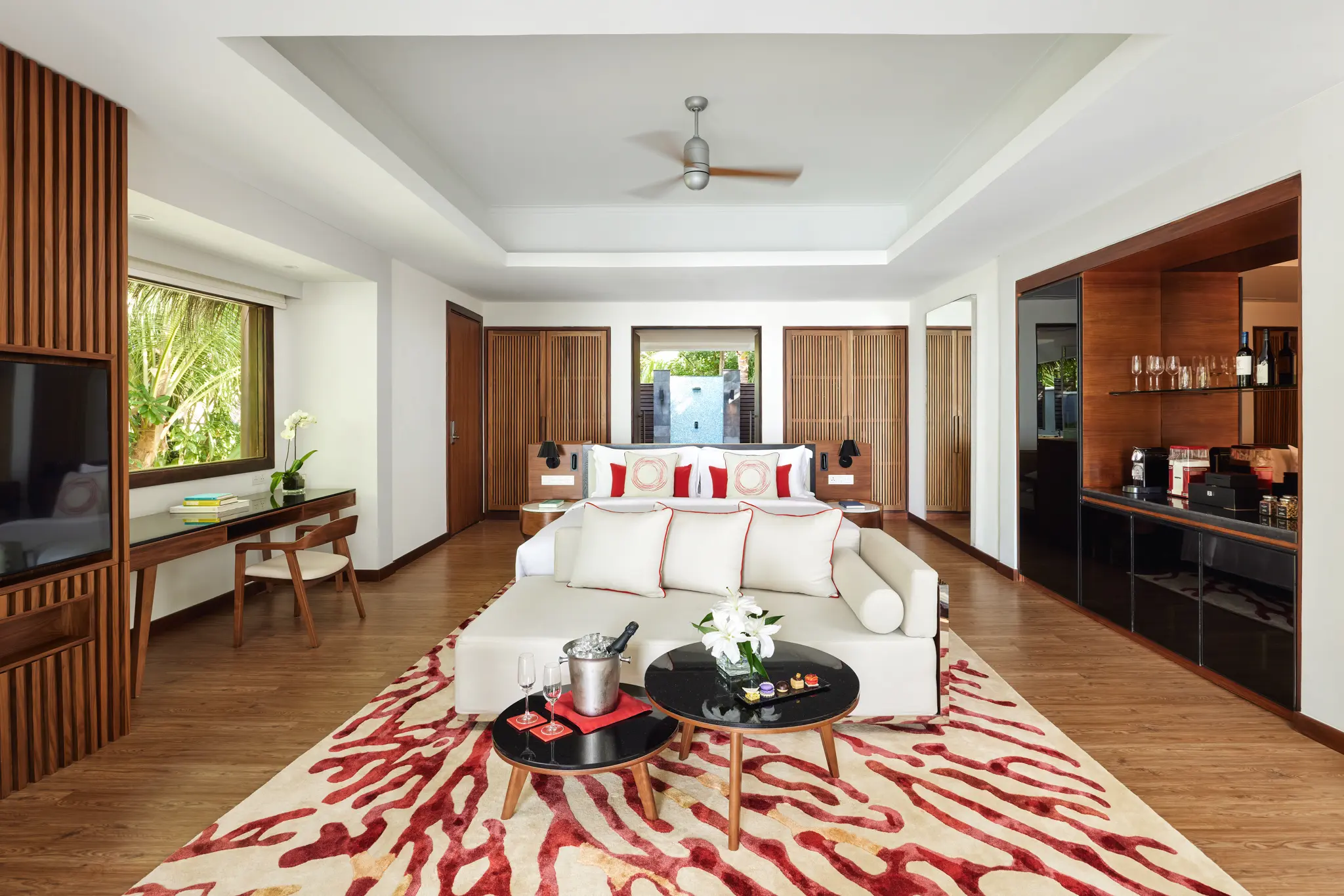 niyama private islands maldives deluxe beach villa interior showcasing a refined luxury space with natural island textures warm lighting and a calm contemporary coastal ambiance