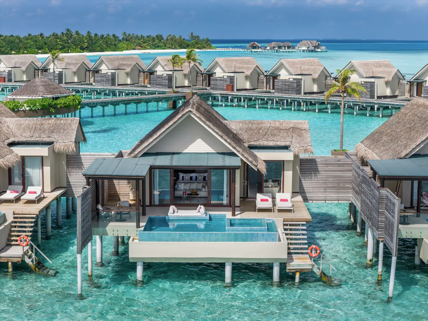 niyama private islands maldives deluxe over water pool villa exterior with serene oceanfront views and refined island elegance