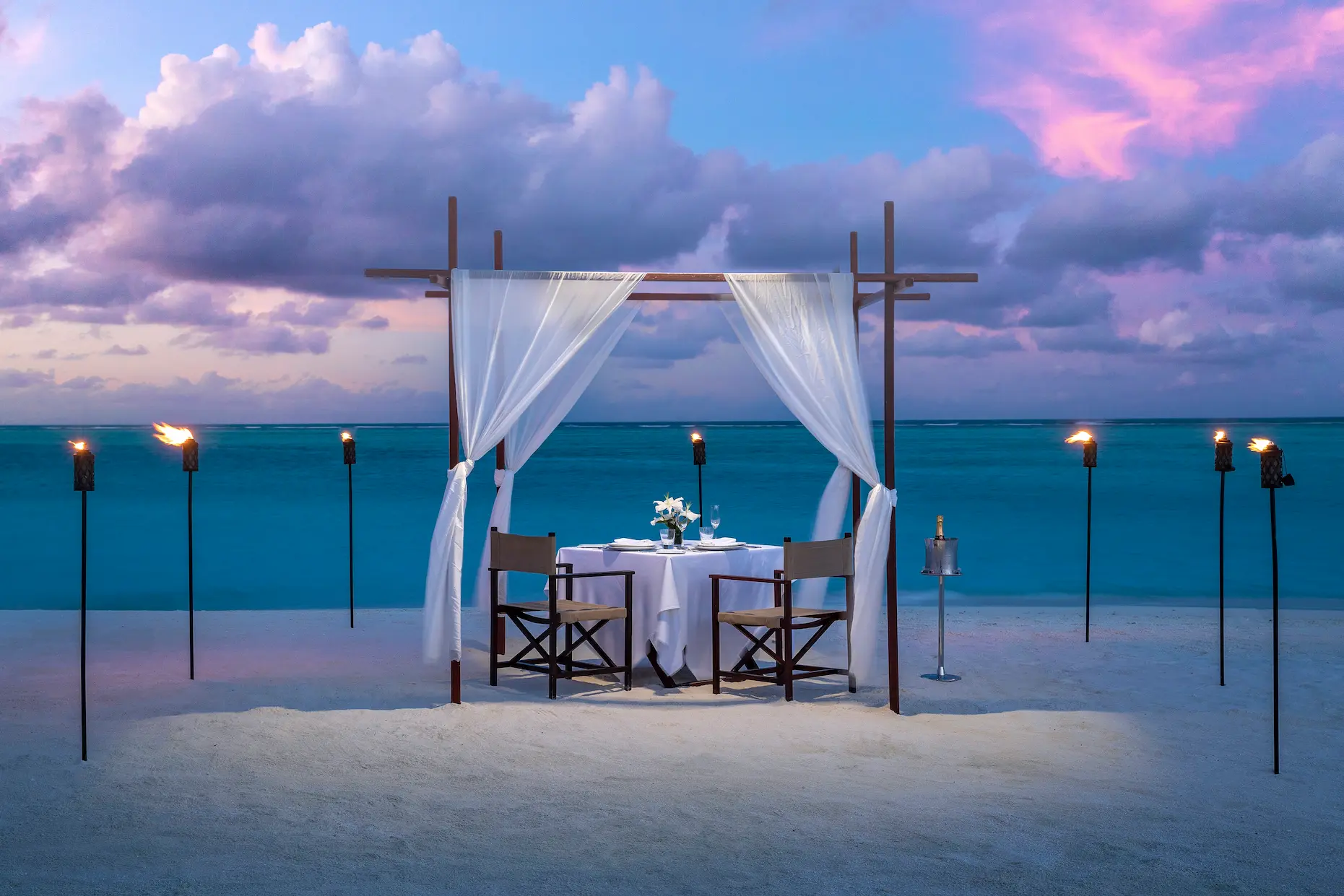 niyama private islands maldives destination dining showcasing intimate bespoke island dining experiences with refined beachfront ambiance