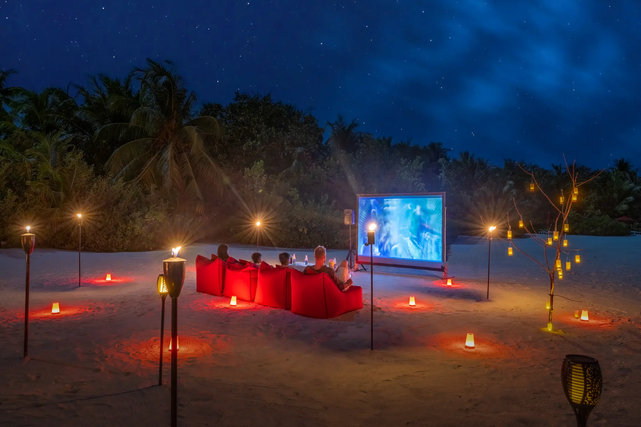 niyama private islands maldives movie under the stars family experience featuring relaxed beachfront cinema and serene island ambiance