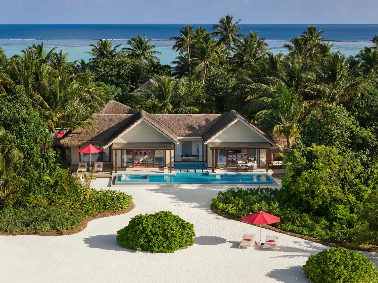 niyama private islands maldives one bedroom beach pool pavilion aerial landscape view showcasing expansive beachfront scenery and elevated island elegance