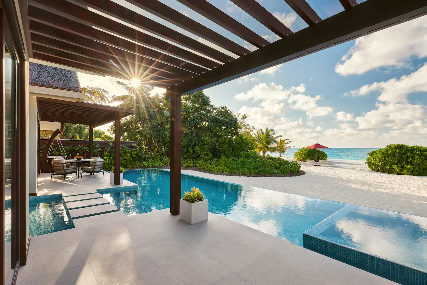 niyama private islands maldives one bedroom beach pool pavilion patio offering tranquil islandside lounging and refined contemporary luxury