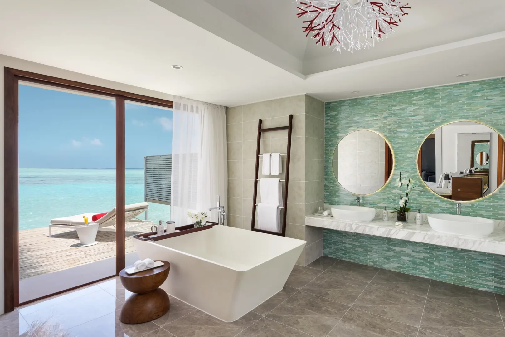 niyama private islands maldives over water pool villa bathroom featuring serene oceanview design and elegant contemporary finishes