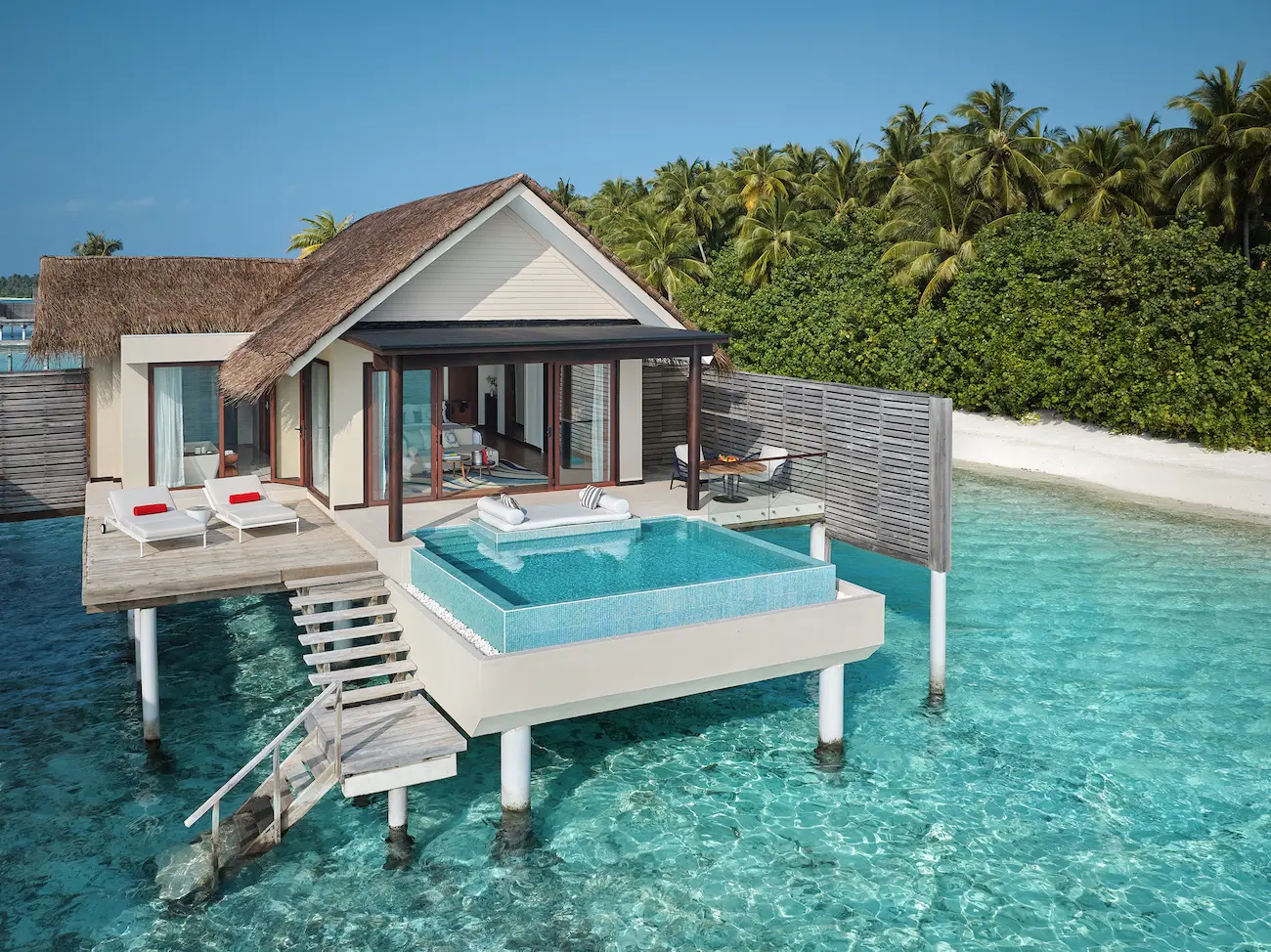 niyama private islands maldives over water pool villa exterior bliss by day showcasing tranquil oceanfront architecture and serene island elegance