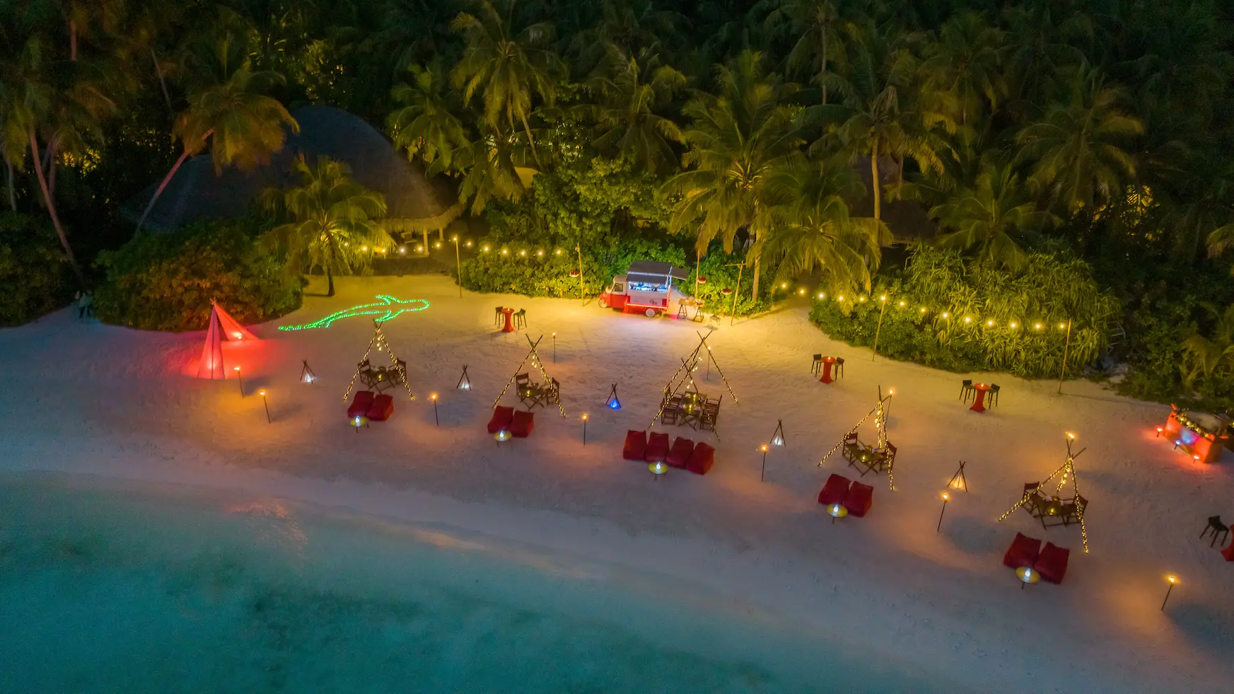 niyama private islands maldives took took street food on the beach aerial view showcasing vibrant island flavors and relaxed beachfront atmosphere
