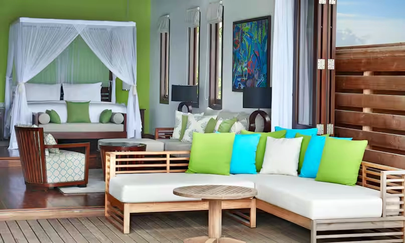 outdoor sofa at northolme grand oceanview villa with infinity pool, tropical surroundings, and panoramic ocean view