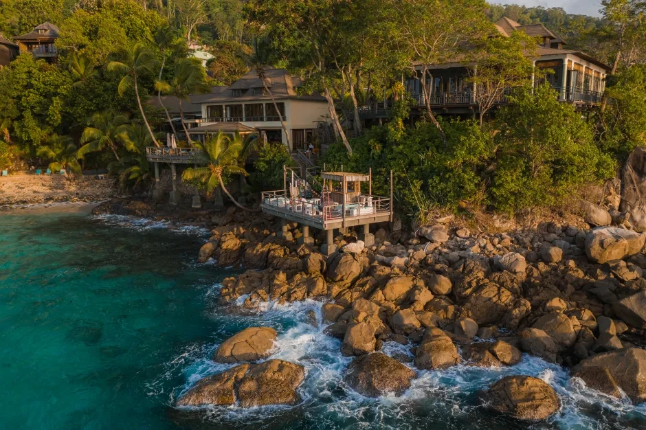 lower deck bar at northolme seychelles with tropical decor, seating area, and ocean view