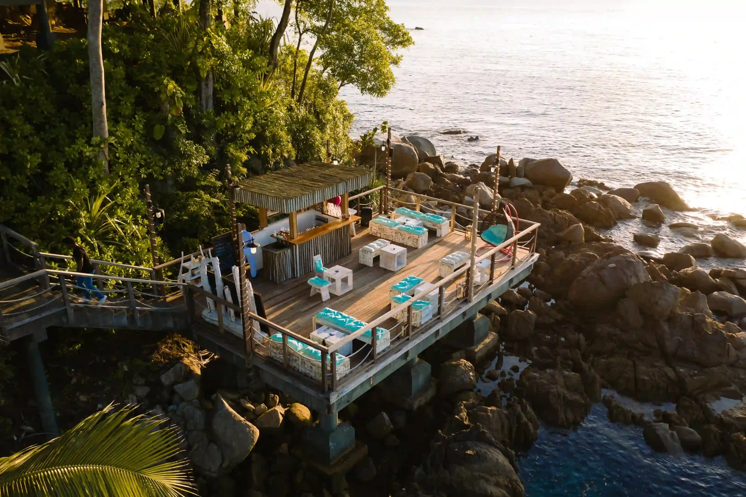 lower deck restaurant at northolme seychelles with outdoor dining, tropical surroundings, and ocean view
