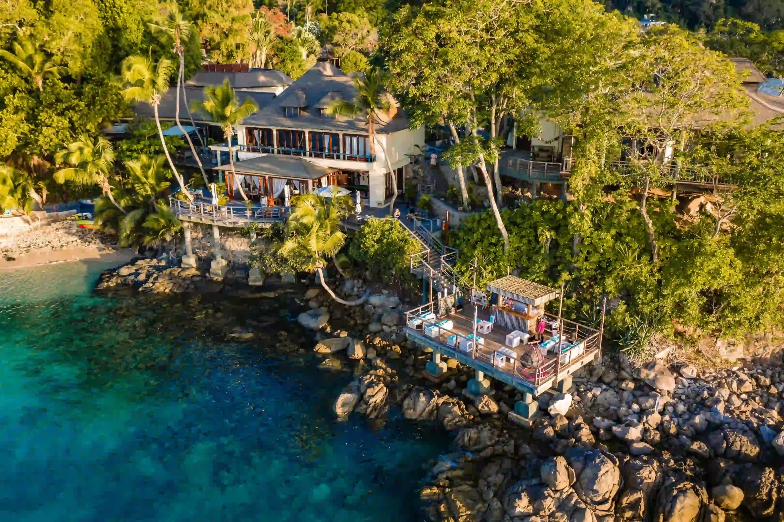 lower deck restaurant at northolme seychelles with outdoor dining, tropical surroundings, and ocean view