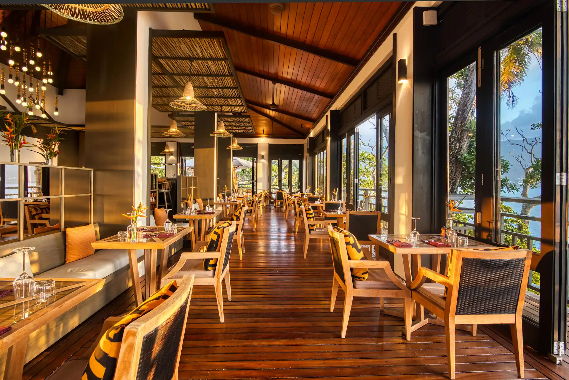 restaurant at northolme seychelles on mahe island with outdoor seating, tropical decor, and ocean view